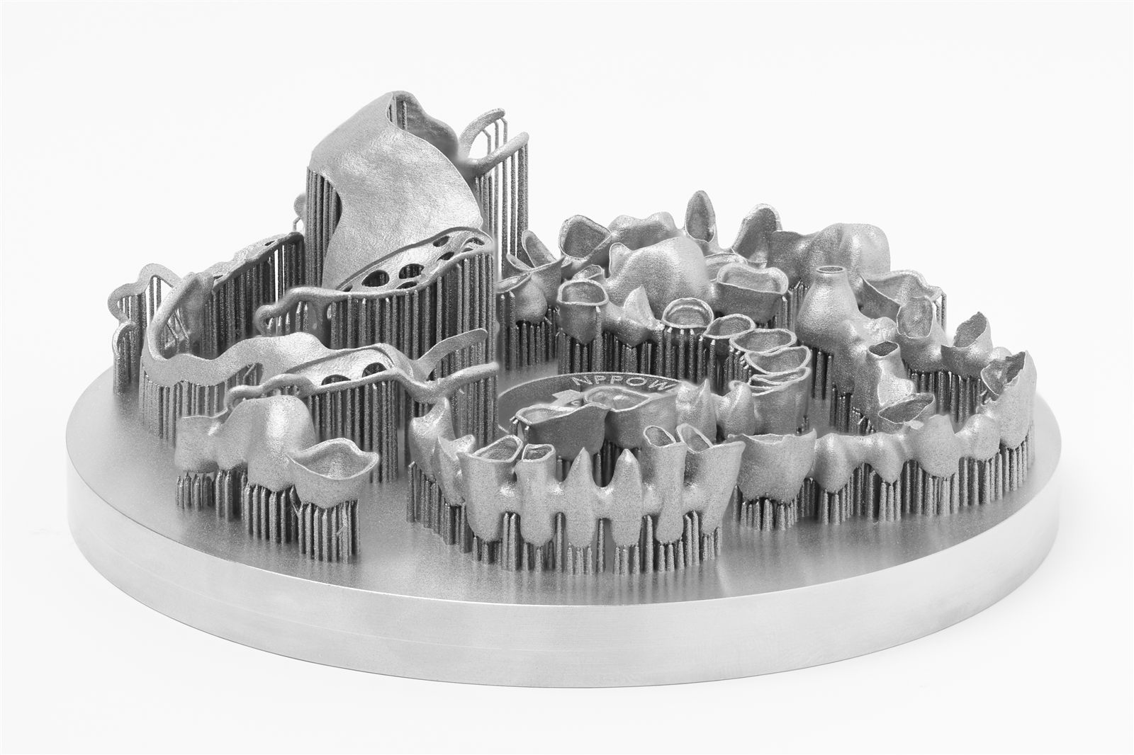 Side view of a Malachite build plate with printed crowns, bridges and frameworks